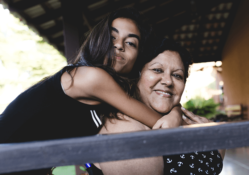 A mother and daughter embracing